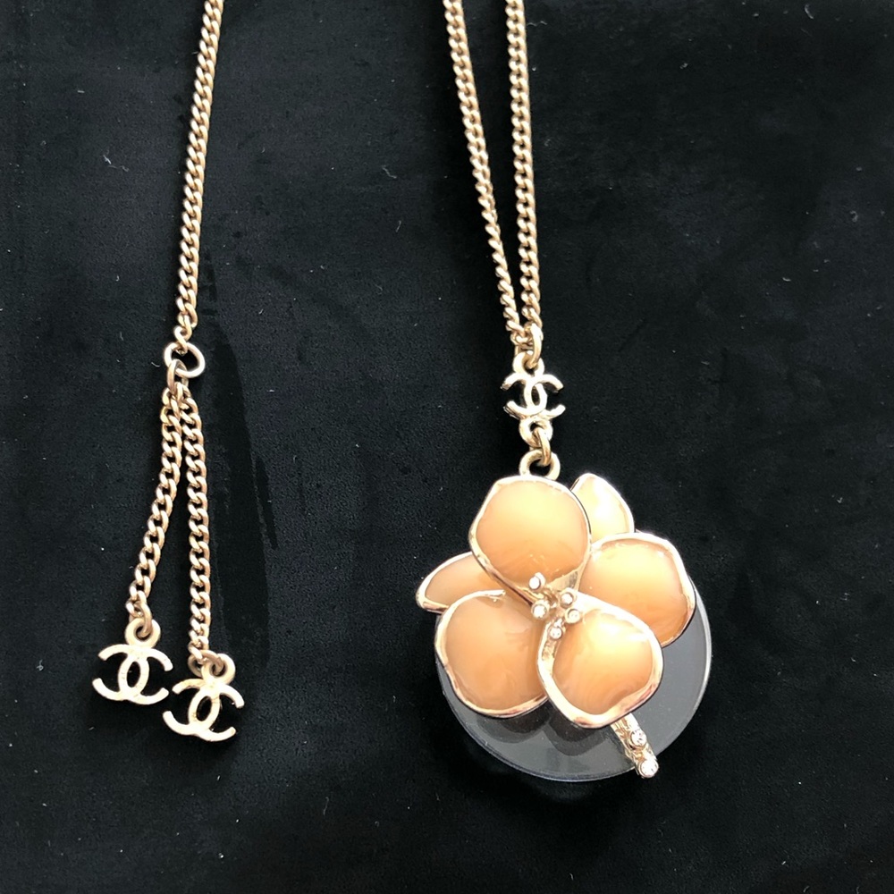Chanel necklace (Dior lip glow for free)